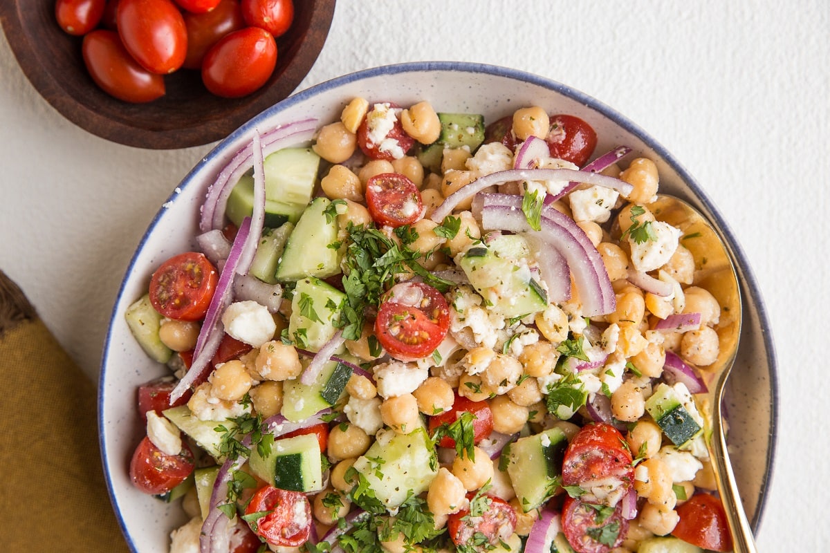 Horizontal image of garbanzo bean salad in a bowl