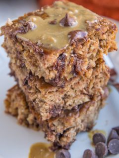 Close up photo of a stack of three slices of peanut butter banana baked oatmeal