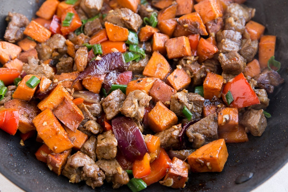 Finished steak tips in a skillet