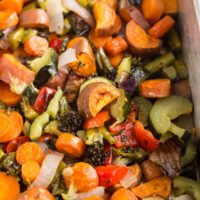 Big batch of roasted veggies in a large roasting pan or casserole dish