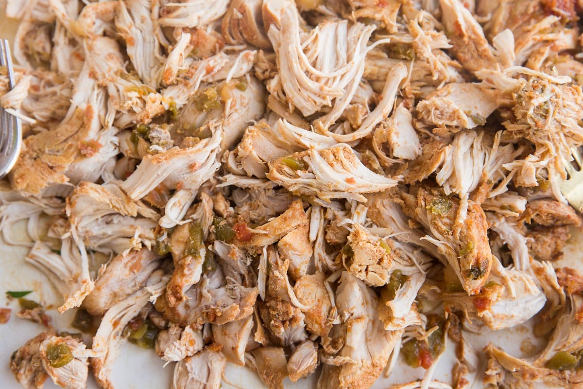 Shredded chicken on a cutting board