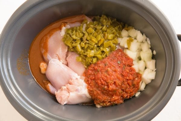 Ingredients for Mexican Shredded Chicken in a slow cooker