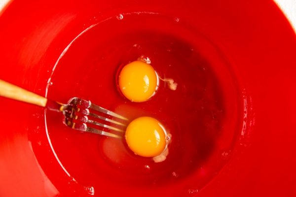 Coconut oil and eggs in a mixing bowl