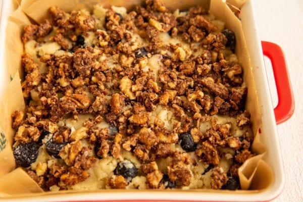 Coffee cake batter in a cake pan ready to go into the oven