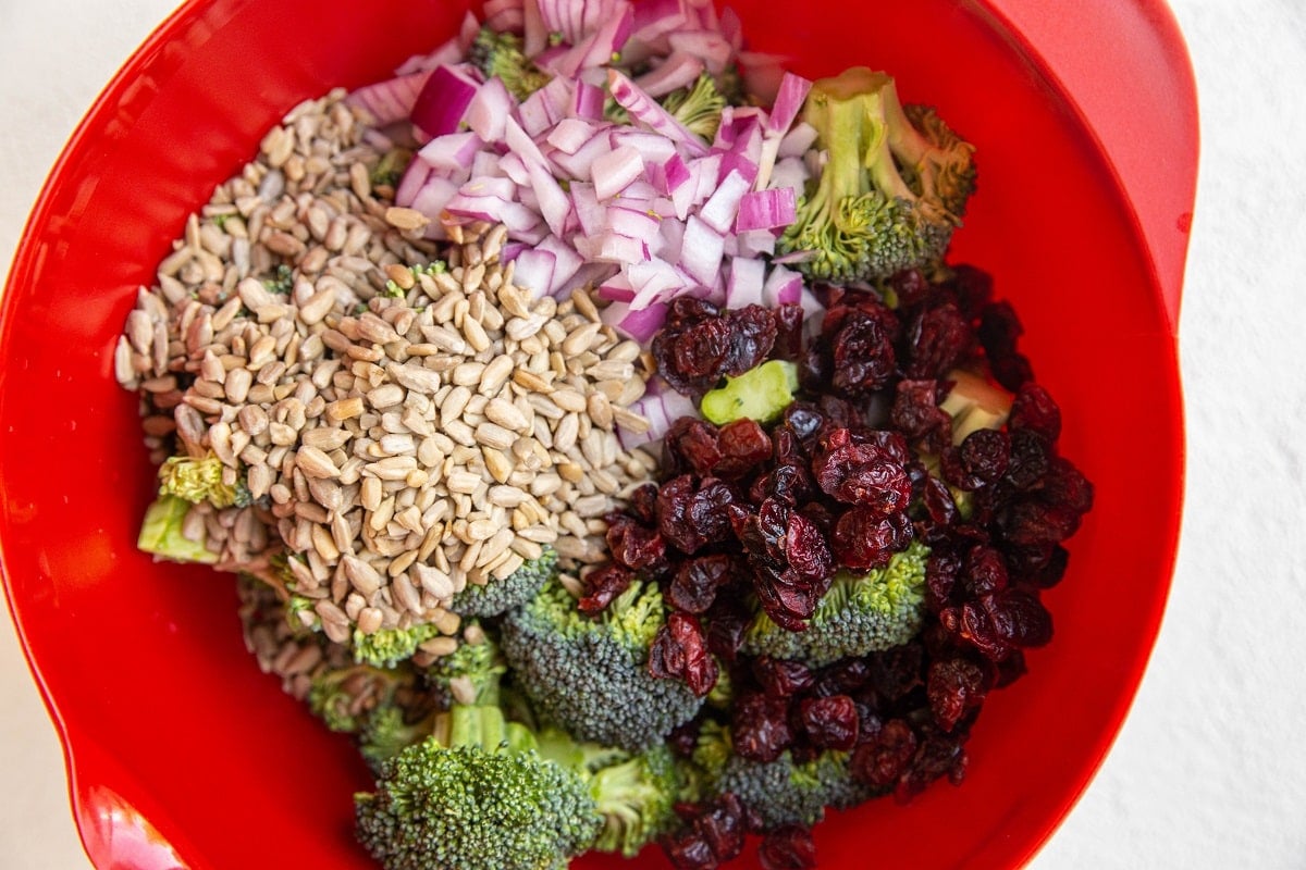 broccoli salad ingredients in a mixing bowl