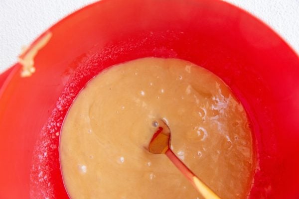 mixing bowl with wet ingredients stirred up.