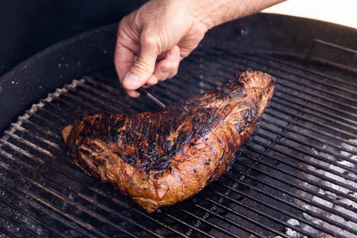 meat thermometer being inserted into a tri tip roast