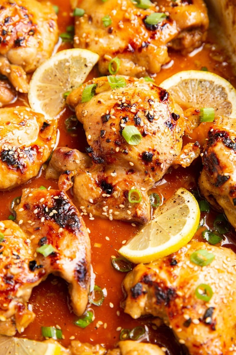 casserole dish of honey lemon garlic chicken