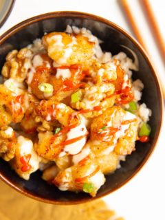 Bowl of Honey Walnut Shrimp with green onions on top