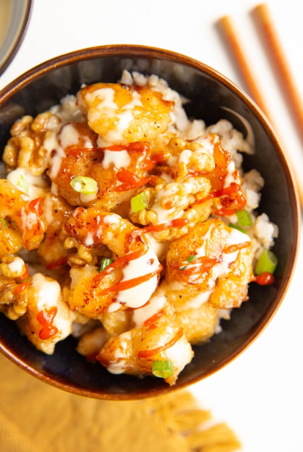 Bowl of Honey Walnut Shrimp with green onions on top