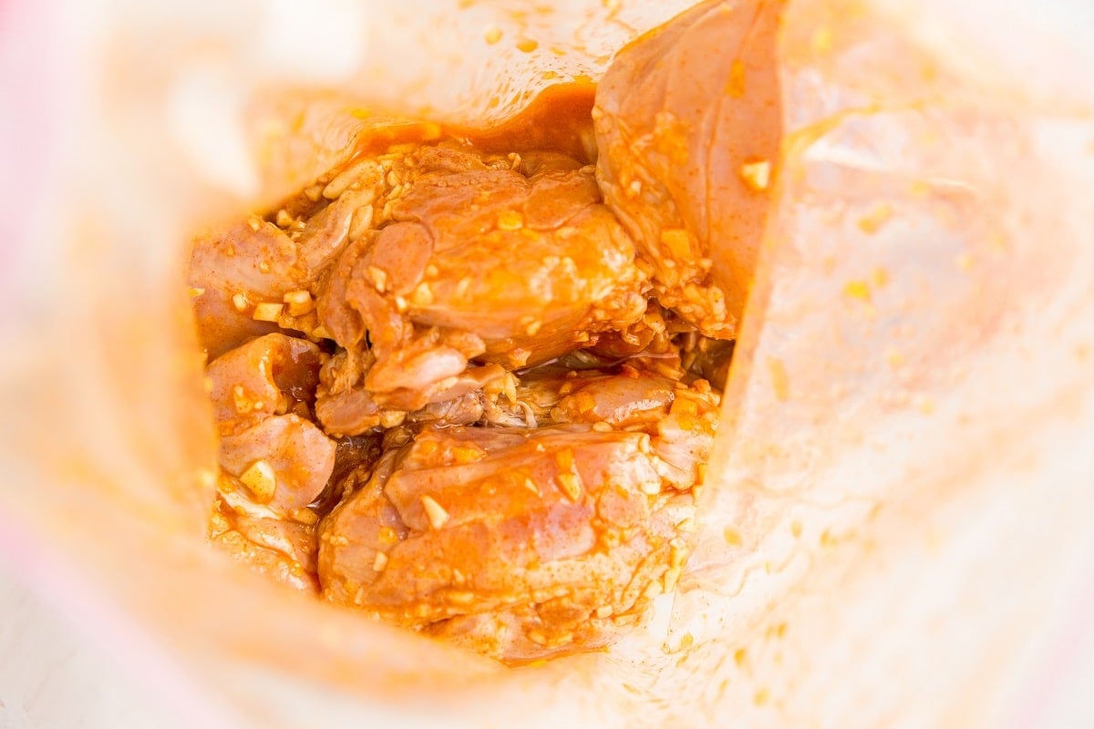 Zip lock bag with marinated chicken thighs inside