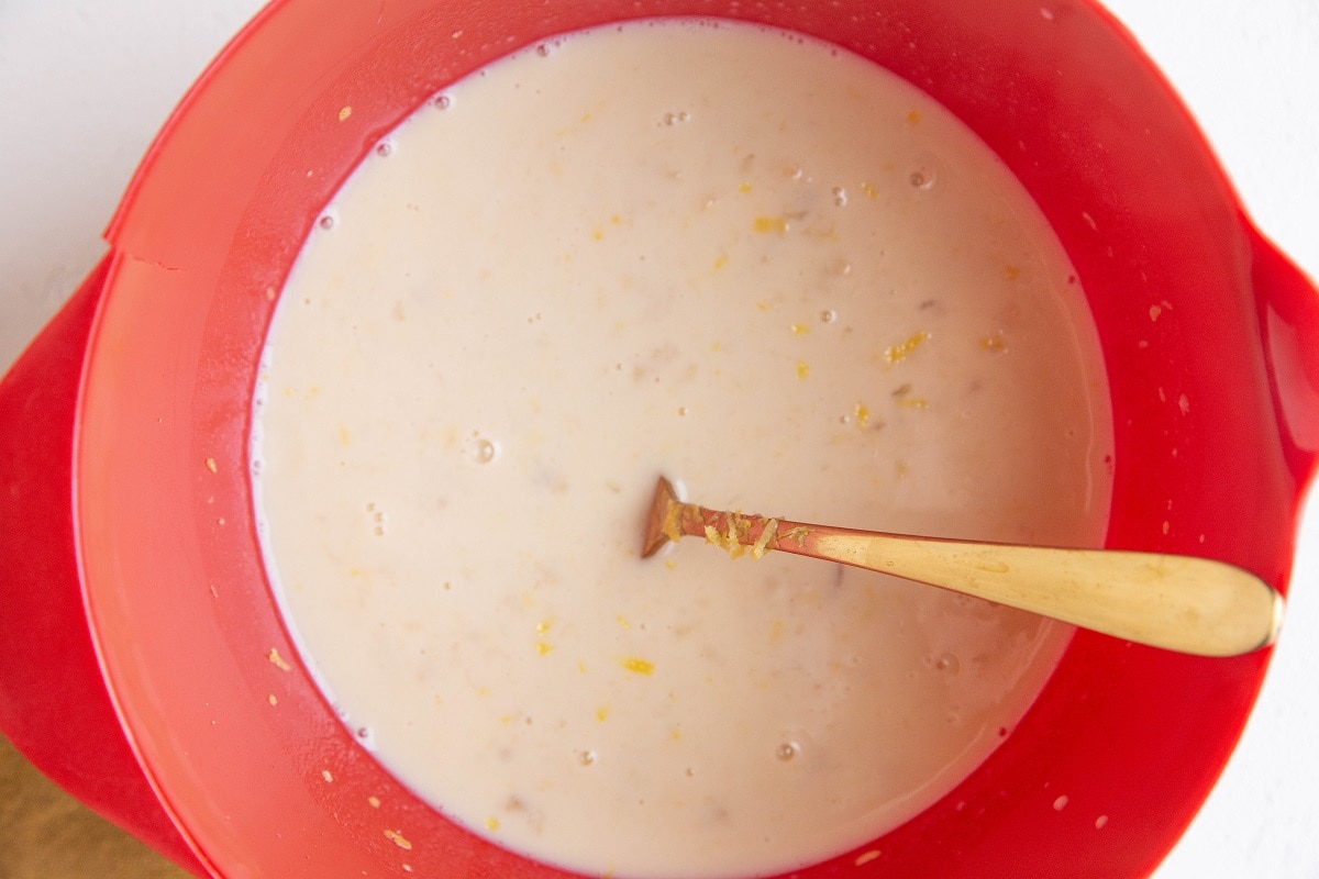 Wet ingredients for the lemon poppy seed baked oatmeal muffins in a mixing bowl
