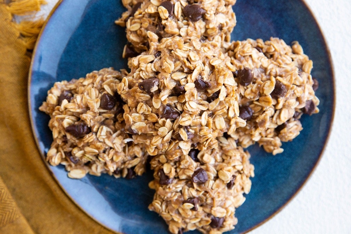 horizontal photo of blue plate of 4 healthy banana cookies