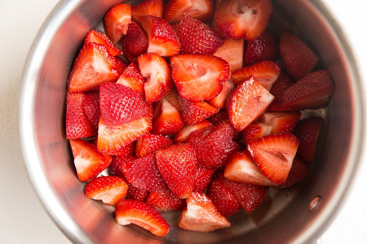 Fresh strawberries in a saucepan to make strawberry filling