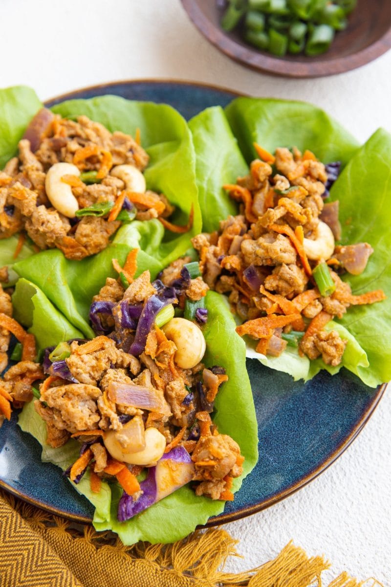 Blue plate of three turkey lettuce wraps