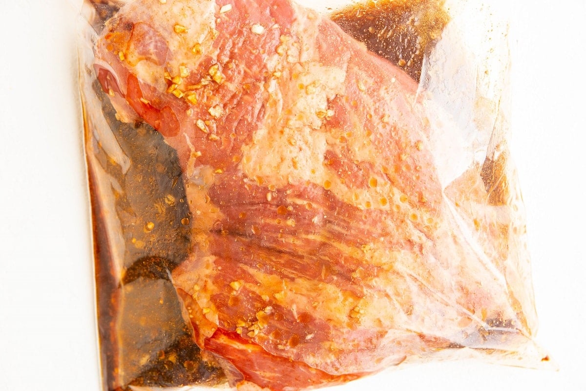 tri tip in a zip lock bag with marinade