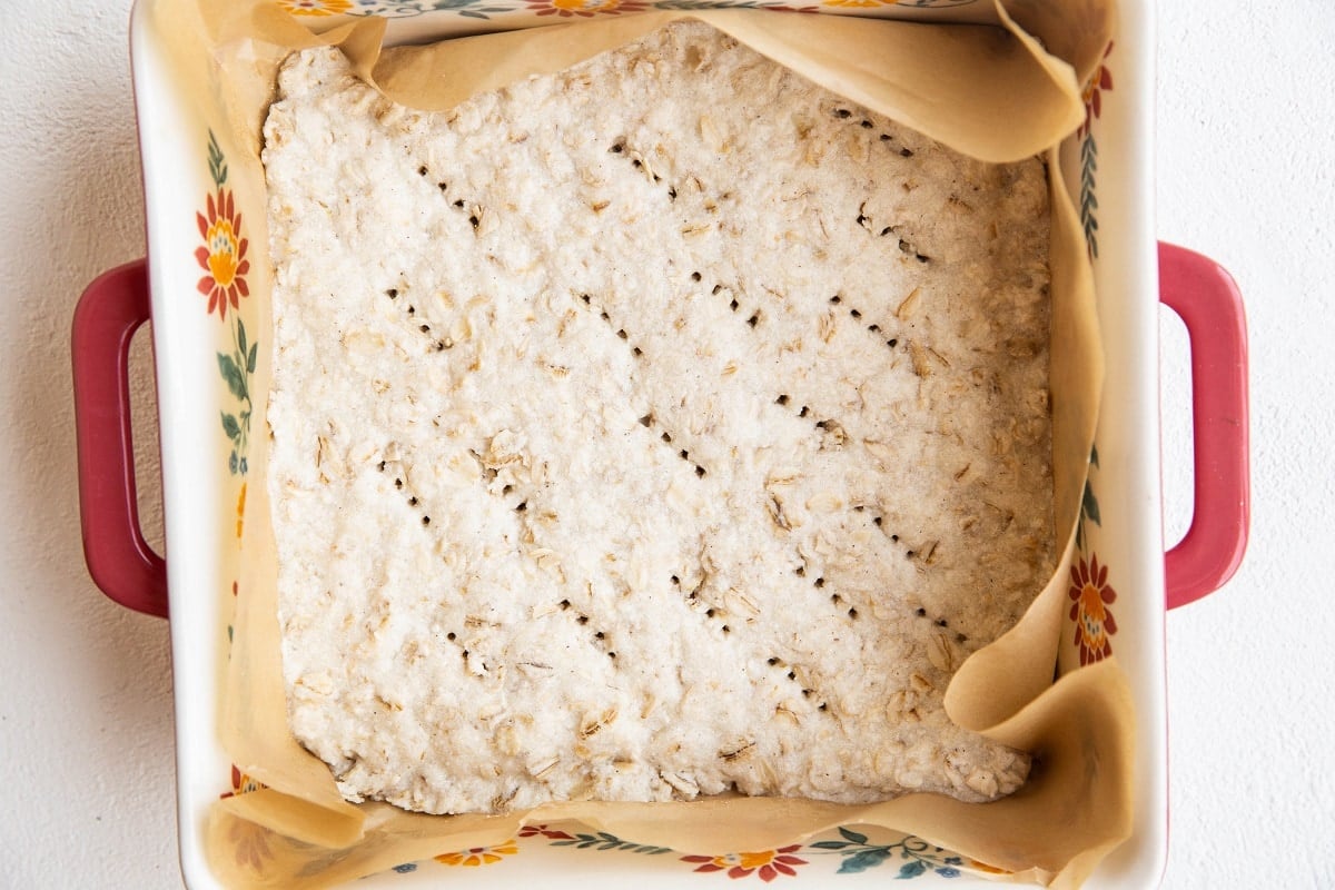 Finished oatmeal bar crust in a baking dish.