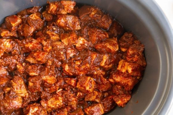 marinated pork in a slow cooker, ready to cook