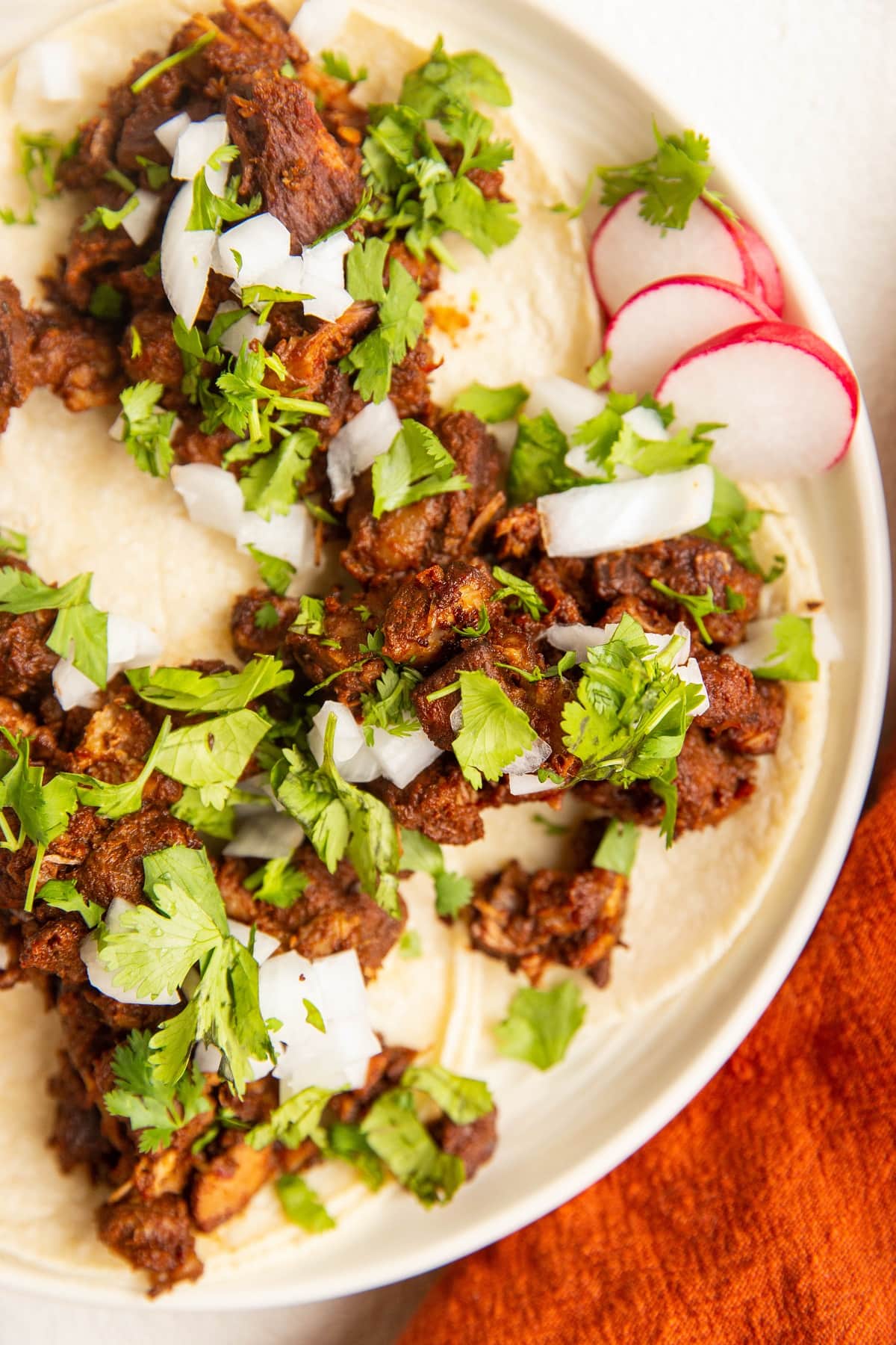 Plate of al pastor tacos