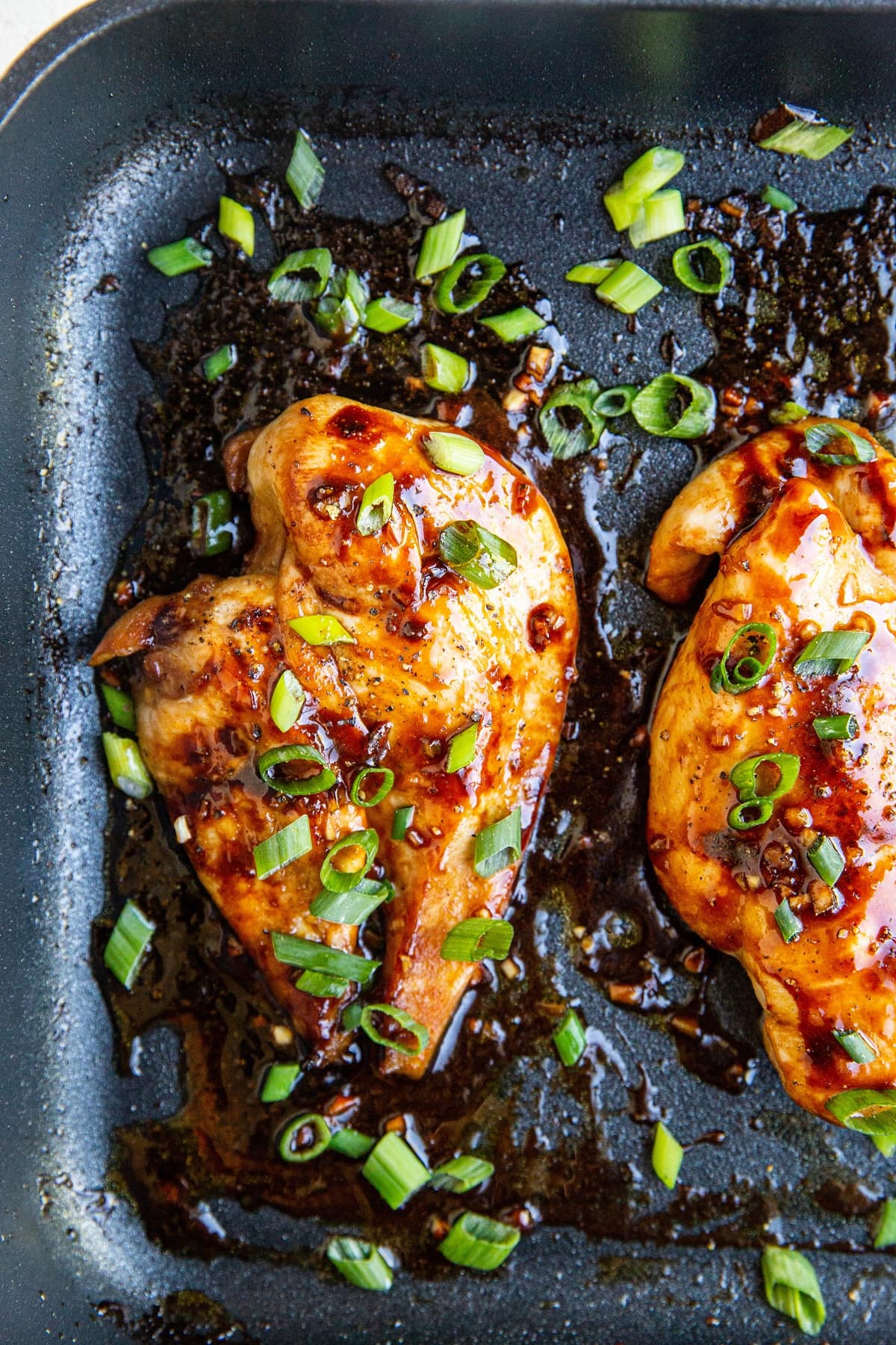 Asian chicken breasts in a casserole dish