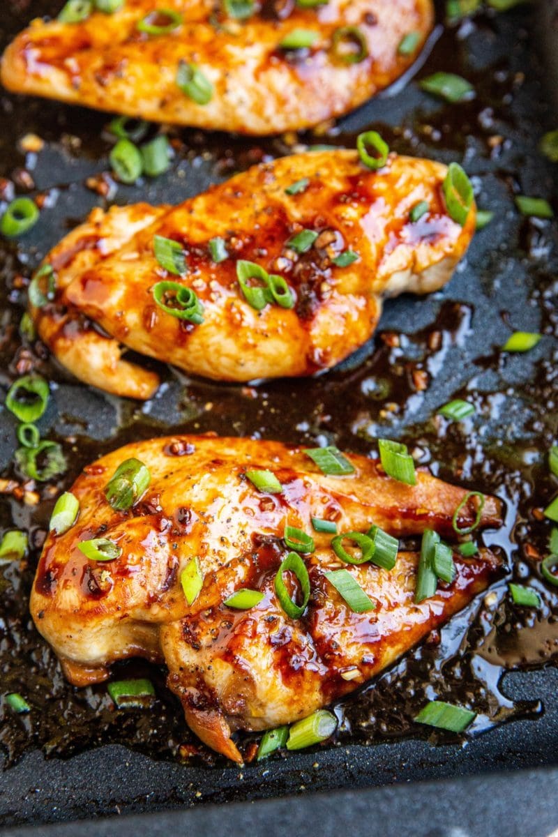 Asian baked chicken breasts in a baking pan