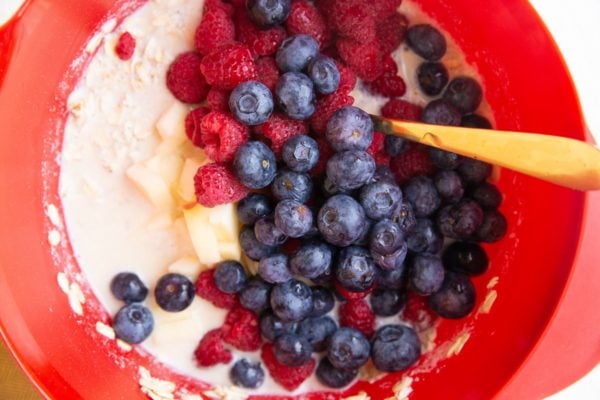 Ingredients for baked oatmeal muffins in a mixing bowl