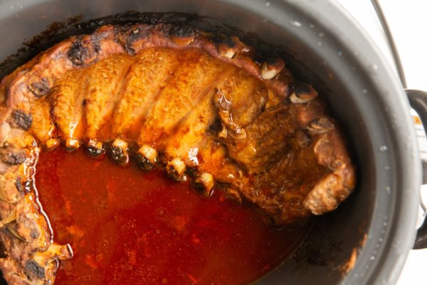 FInished baby back ribs in a crock pot