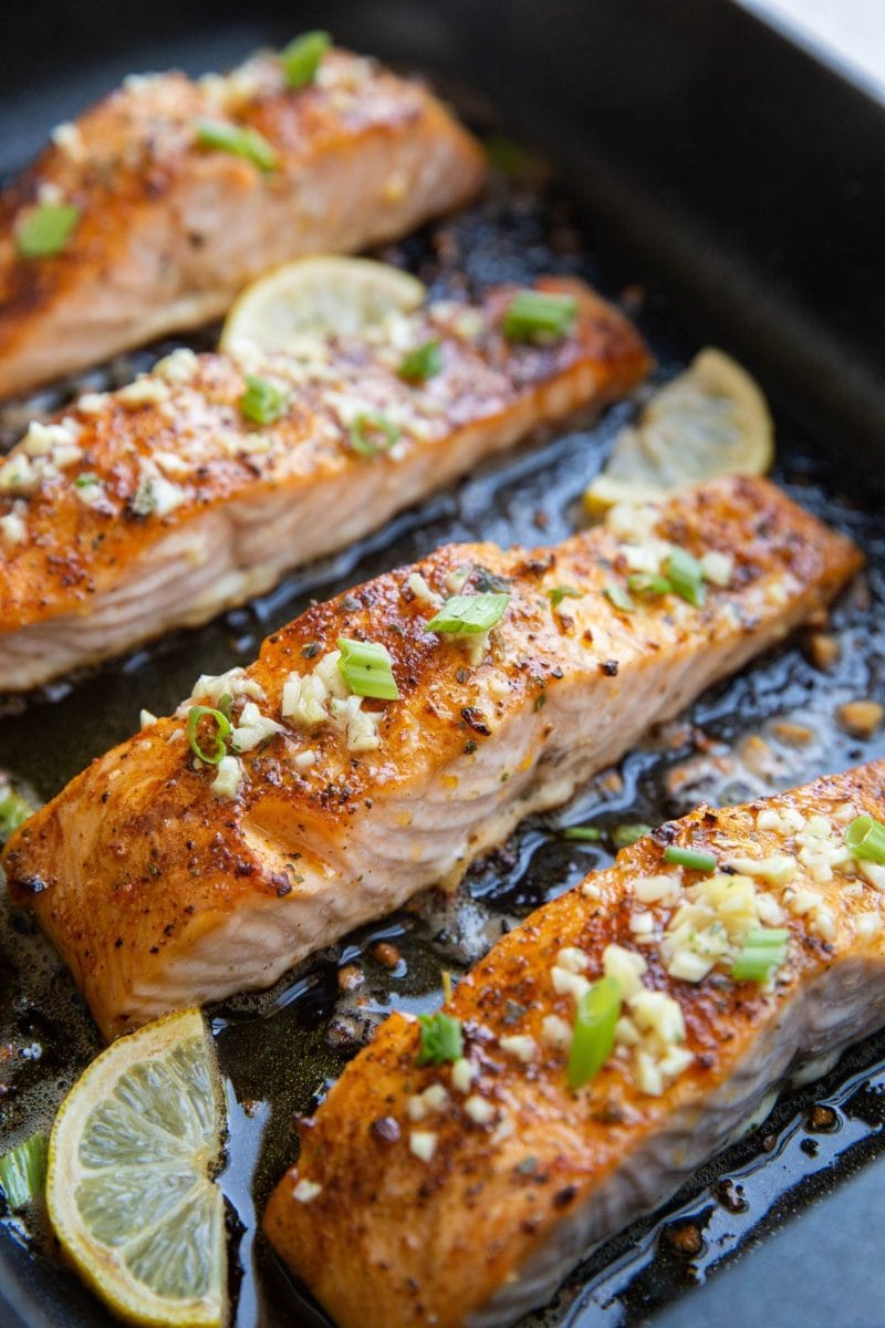 big roasting pan with finished garlic butter baked salmon