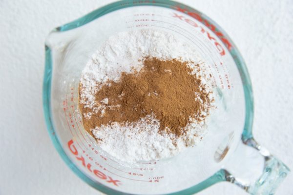 Flour, cinnamon, and salt in a measuring cup