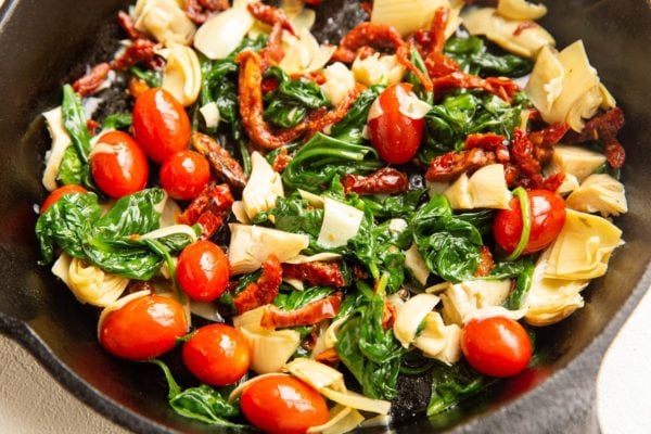 Greek frittata ingredients in a skillet