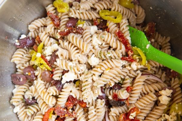 stainless steel mixing bowl with finished pasta salad