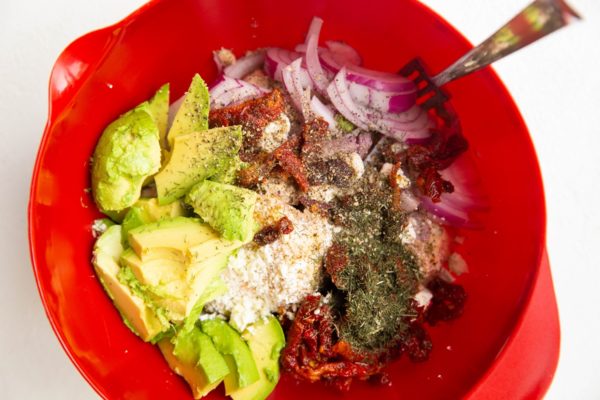 Salmon Avocado Salad ingredients in a mixing bowl