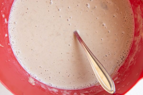 All of the wet ingredients for the muffins in a mixing bowl.