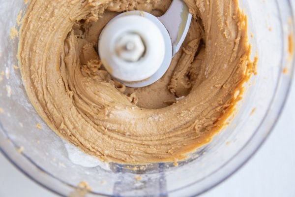 peanut butter protein ball mixture in a food processor