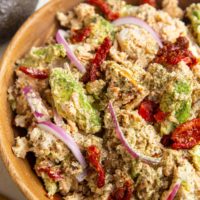 Wooden bowl of Mediterranean salmon salad