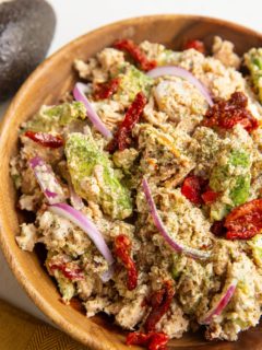 Wooden bowl of Mediterranean salmon salad