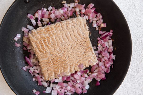 Turkey and onion cooking in a skillet