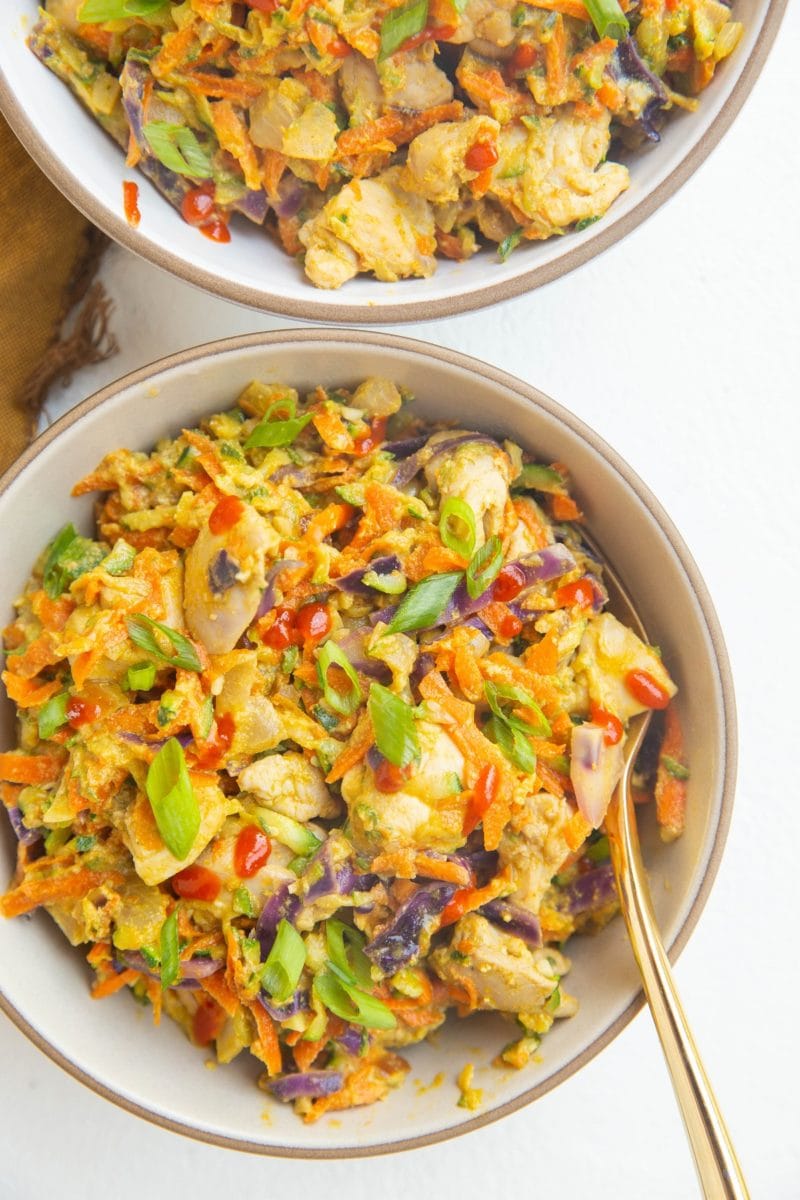 close up two bowls of Thai zucchini and chicken