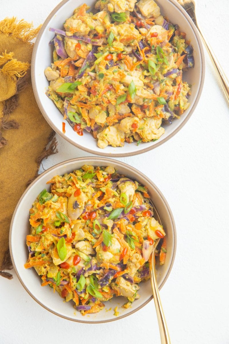 two bowls of zucchini and chicken with Thai sauce