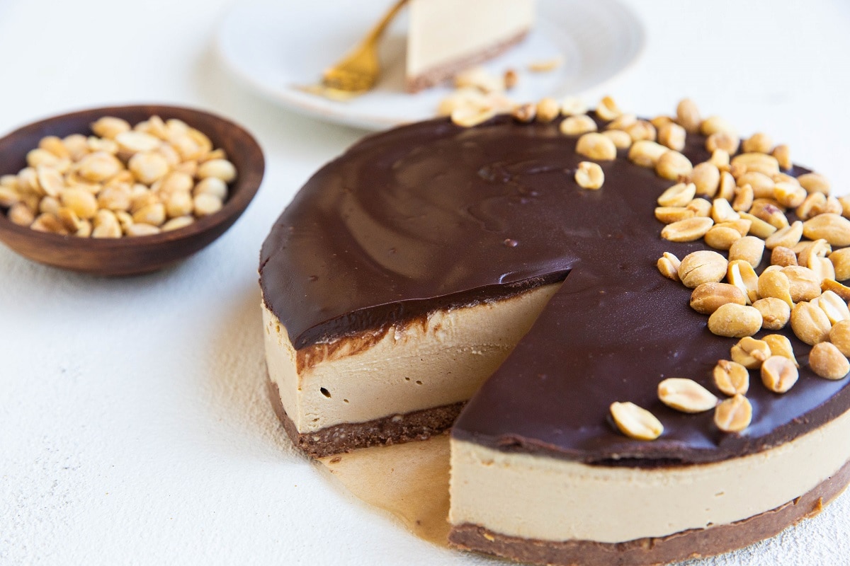 horizontal photo of peanut butter pie with slice taken out