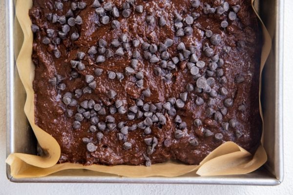 Brownie batter in a baking pan ready to go into the oven.