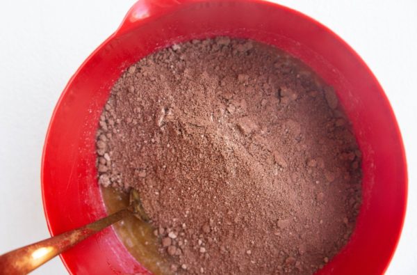 dry ingredients on top of the wet ingredients in a bowl