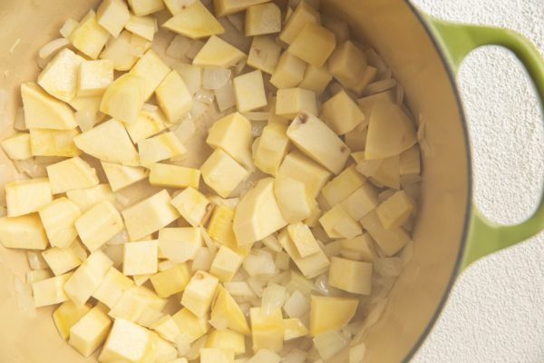 Potatoes and onion cooking in a pot