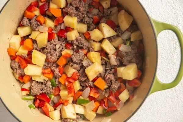 Picadillo ingredients cooking in a pot