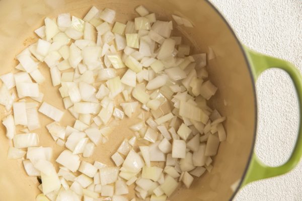 Onion sautéing in a large pot