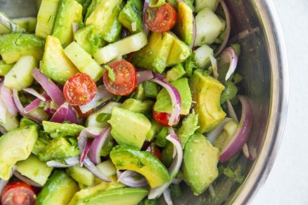 Finished avocado salad in a mixing bowl, ready to be served