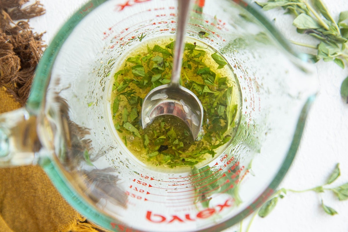 Dressing for avocado salad in a measuring cup