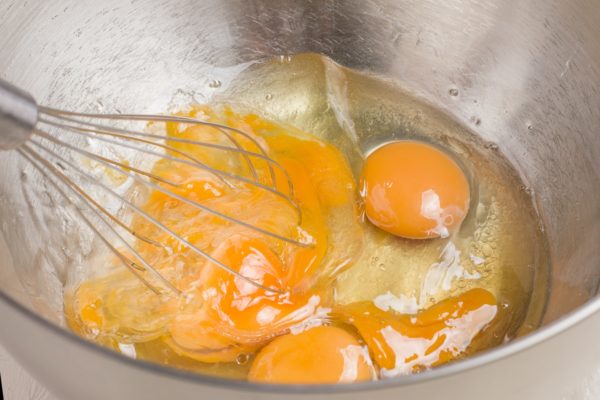 Whisking eggs in a mixing bowl