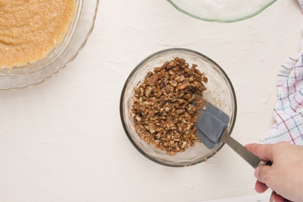 Stirring the ingredients for the streusel topping in a bowl.