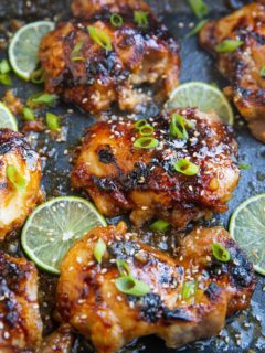 photo of honey lime chicken thighs all sticky and delicious in a casserole dish